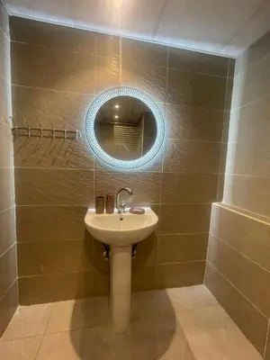 a bathroom with a sink and a mirror at Florenza Khamsim 307 in Hurghada