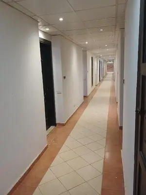 an empty hallway of an office building with white walls at Florenza Khamsim 307 in Hurghada