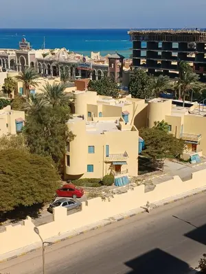 a view of a city with houses and the ocean at Florenza Khamsim 307 in Hurghada