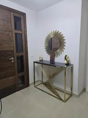 a mirror on top of a table next to a door at El Gouna Cyan Ringe Villa with infinity pool in Hurghada