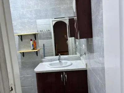 a bathroom with a sink and a mirror at Apartment in Elhilal, Hurghada in Hurghada
