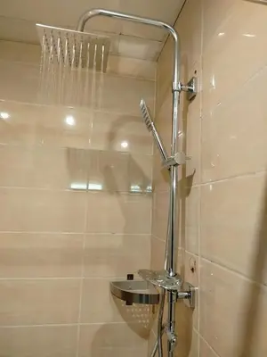 a shower in a bathroom with a shower head at nice apartment in Hurghada