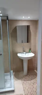 a bathroom with a sink and a shower at Bay View, Sahl Hashish in Hurghada