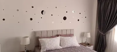 a bedroom with a bed with a wall with holes at 2 bedroom apartment Bay View sahl hasheesh in Hurghada