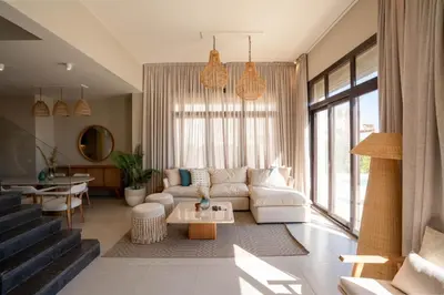 a living room with a couch and a table at Chic Cyan 4BR Villa with Private Pool in Hurghada