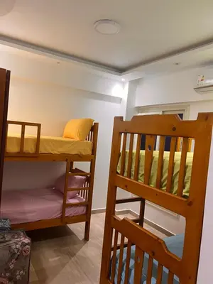 a room with two bunk beds and a ladder at Princess resort Hurghada in Hurghada