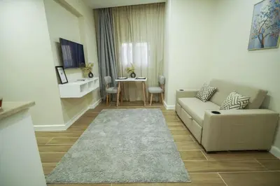 a living room with a couch and a table at modern studio- 7 min from aswan station in Aswan