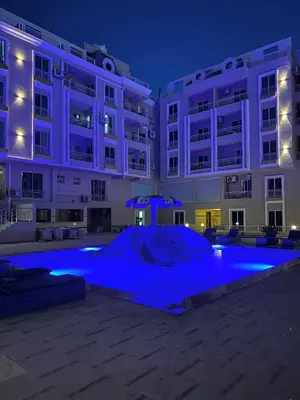 a large building with blue lighting in front of it at Hurghada Hub Resort in Hurghada