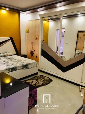 a bedroom with a bed and a mirror at Paradise Gates Hurghada in Hurghada