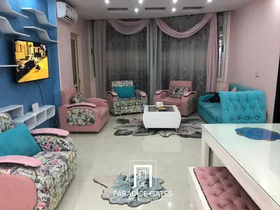 a living room with couches and chairs and a table at Paradise Gates Hurghada in Hurghada