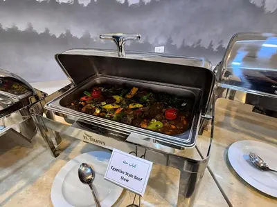 a buffet with a pot of food on a table at Fanadir Bay Premier all inclusive resort in Hurghada