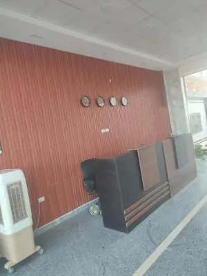 a wall with clocks on the side of a building at Luxuries Studios and apartments in Oasis Marina ,Hurghada in Hurghada