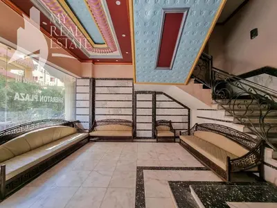 a room with stairs and benches in a building at Sheraton Plaza Hurghada in Hurghada