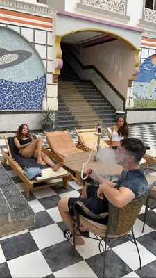 a group of people sitting at a table in front of a piano at Sheraton Plaza Hurghada in Hurghada