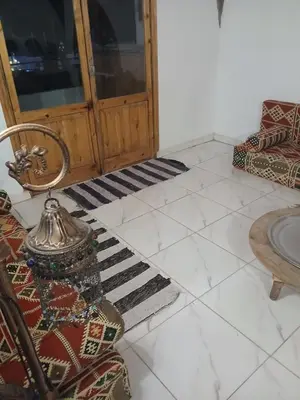 a living room with a couch and a table at Talamermaid in Hurghada