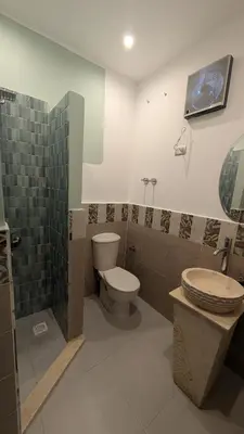 a bathroom with a toilet and a sink at Hostify Hostel and Rooftop in Hurghada