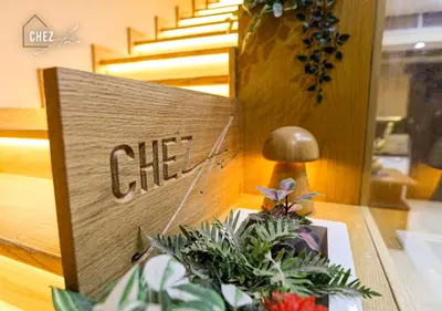 a sign for a store with plants on a counter at Luxury Rooftop Penthouse Sea View & Pools in Hurghada