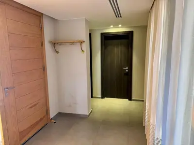 an empty hallway with a door and a room with a floor at Gouna Ancient Hill 3 BDR Nanny Privat Pool Lagoon View in El Gouna