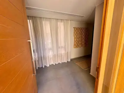 an empty hallway with a window with a curtain at Gouna Ancient Hill 3 BDR Nanny Privat Pool Lagoon View in El Gouna
