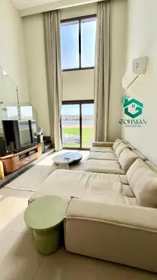 a large bed in a room with a large window at Shedwan Twinhouse 3 bedrooms in Hurghada