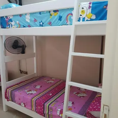 a bedroom with two bunk beds with a crib at Sweet Home Hostel in Hurghada