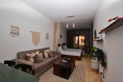 a living room with a couch and a table at Turtles Beach Resort, Al Ahyaa in Hurghada