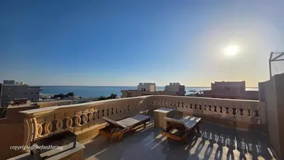 a balcony with a view of the ocean at Safaga SeaView Rooftop in Safaga