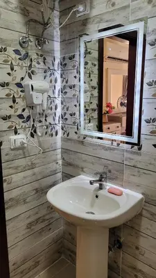 a bathroom with a sink and a mirror at Casablanca star hurghada in Hurghada
