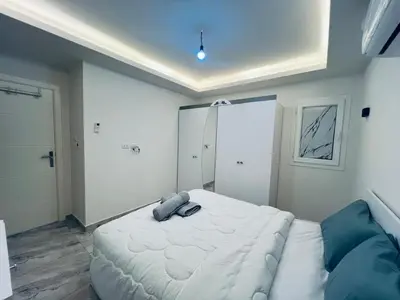 a bedroom with a large white bed in a room at One bedroom and reception Selena bay, Hurghada in Hurghada