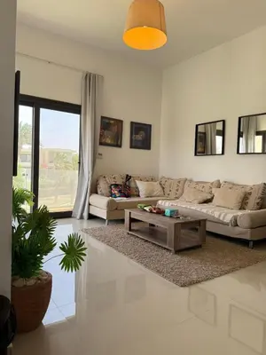 a living room with a couch and a coffee table at 2BR G-Cribs in Hurghada