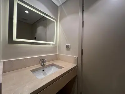 a bathroom with a sink and a mirror at Beachside Mangroovy 1BR in Hurghada
