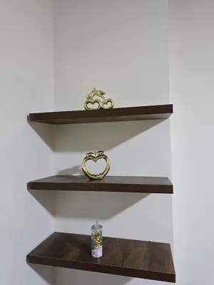a shelf with a ring and a candle on it at Golden Tiba in Hurghada