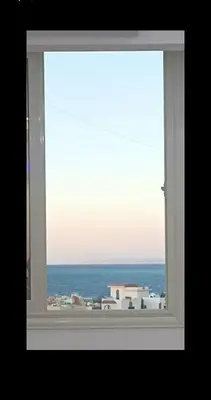a view of the ocean from a window at Dream Apartment 4 in Hurghada