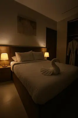 a bedroom with a large bed with a swan on it at Diva Suites in Hurghada