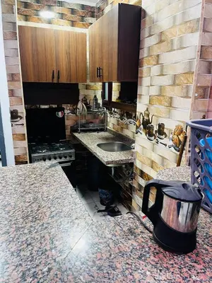 a kitchen with a sink and a counter top at شقه في ميدان العروسه in Hurghada