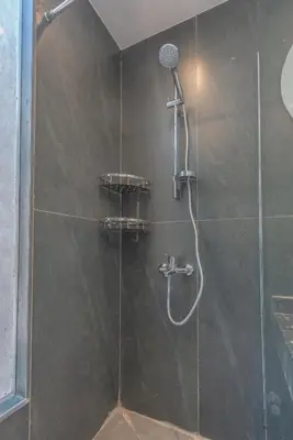 a shower with a shower head and a glass door at Lovely 2BR with Private Pool in Bali El Gouna in Hurghada