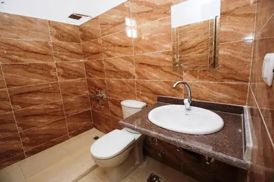 a bathroom with a sink and a toilet at Luxor Hotel in Luxor
