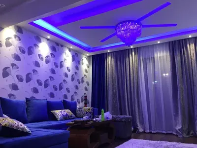 a living room with a purple ceiling with a blue light at The view in Hurghada