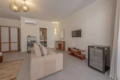 a living room with a couch and a table at Soulful Studio in Bali El Gouna in Hurghada