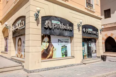 a store with a sign on the side of a building at Ladybird - Veranda Loft in Hurghada