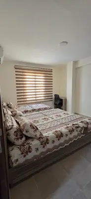 a large bed in a bedroom with a window at Tiba golden resort hurghada holiday in Hurghada