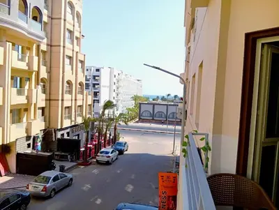 a view from a balcony of a city street with cars at شارع عربيه ع البحر مول السلام أمام مستشفي السلام in Hurghada