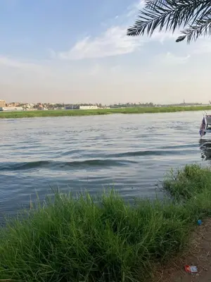 a view of a body of water with a boat at Elbess For Toursim in Luxor