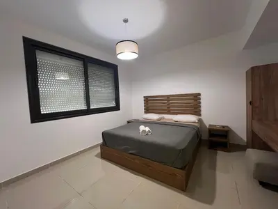 a bedroom with a bed and a window at Modern Studio in G-Cribs El Gouna in Hurghada