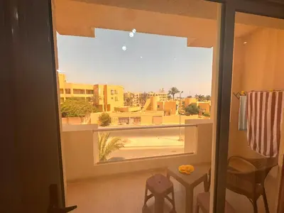 a room with a window with a view of a city at Home 2 Bedroom in Hurghada in Hurghada