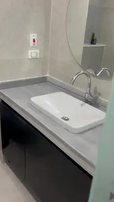 a bathroom with a white sink and a mirror at Scandic resort in Hurghada