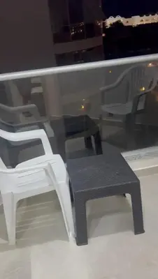 a black and white chair sitting in a window at Scandic resort in Hurghada