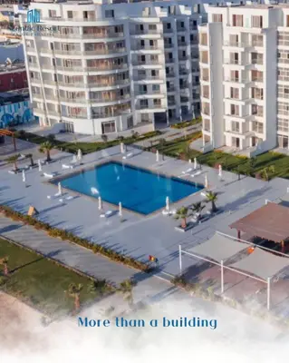 a swimming pool in front of some tall buildings at Scandic resort in Hurghada