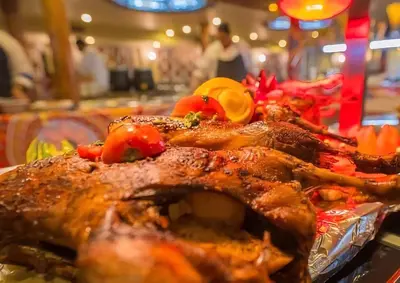 a plate of food with meat and vegetables on a table at Nile cruise from Luxor to Aswan 4 nights From Aswan to Luxor 3 nights in Luxor