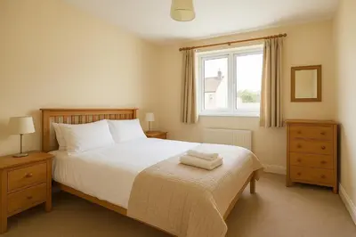 a bedroom with a bed with two towels on it at Luxor temple view in Luxor